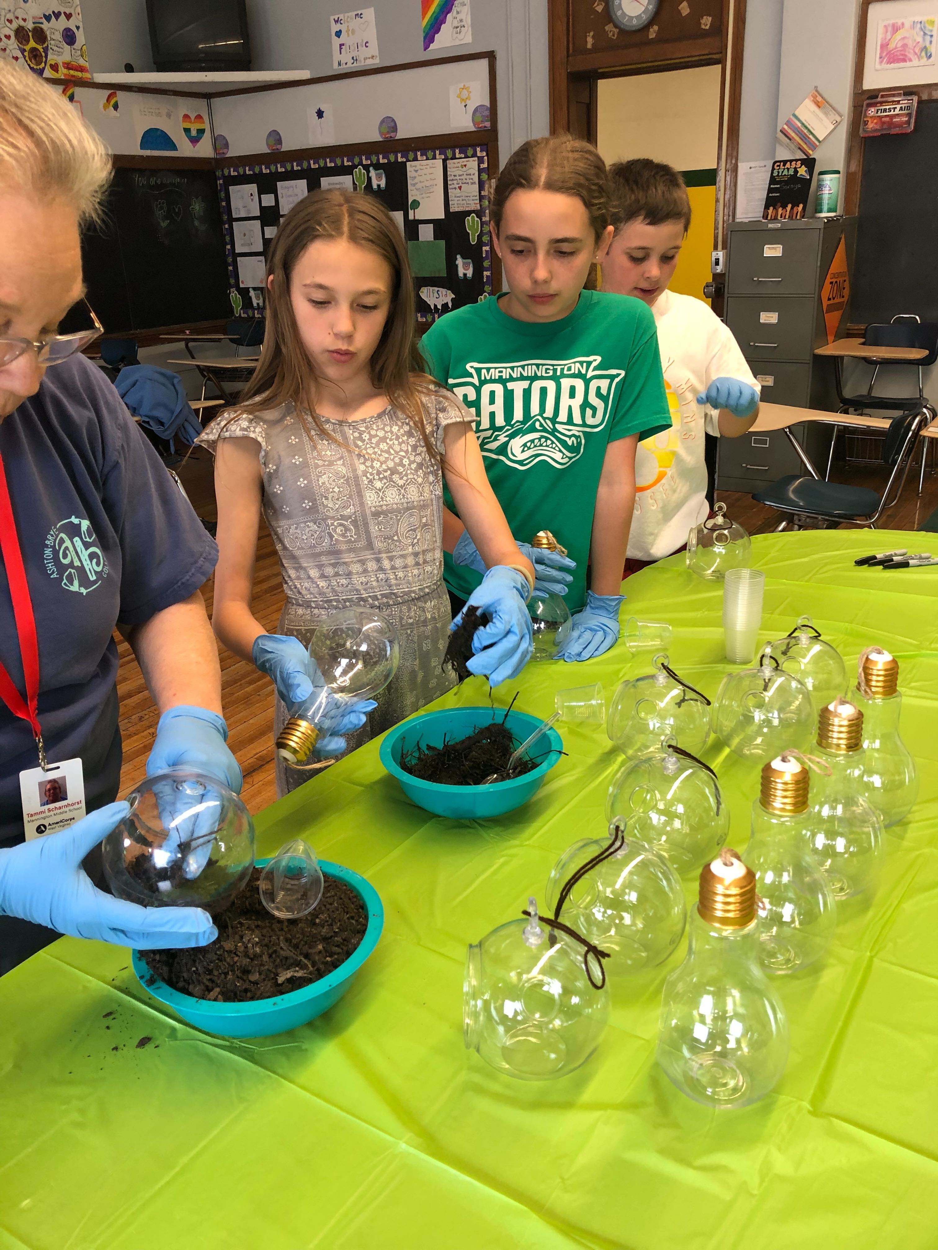 MMS Students work on a Plant Science Project with Site Coordinator Tammi Scharnhorst